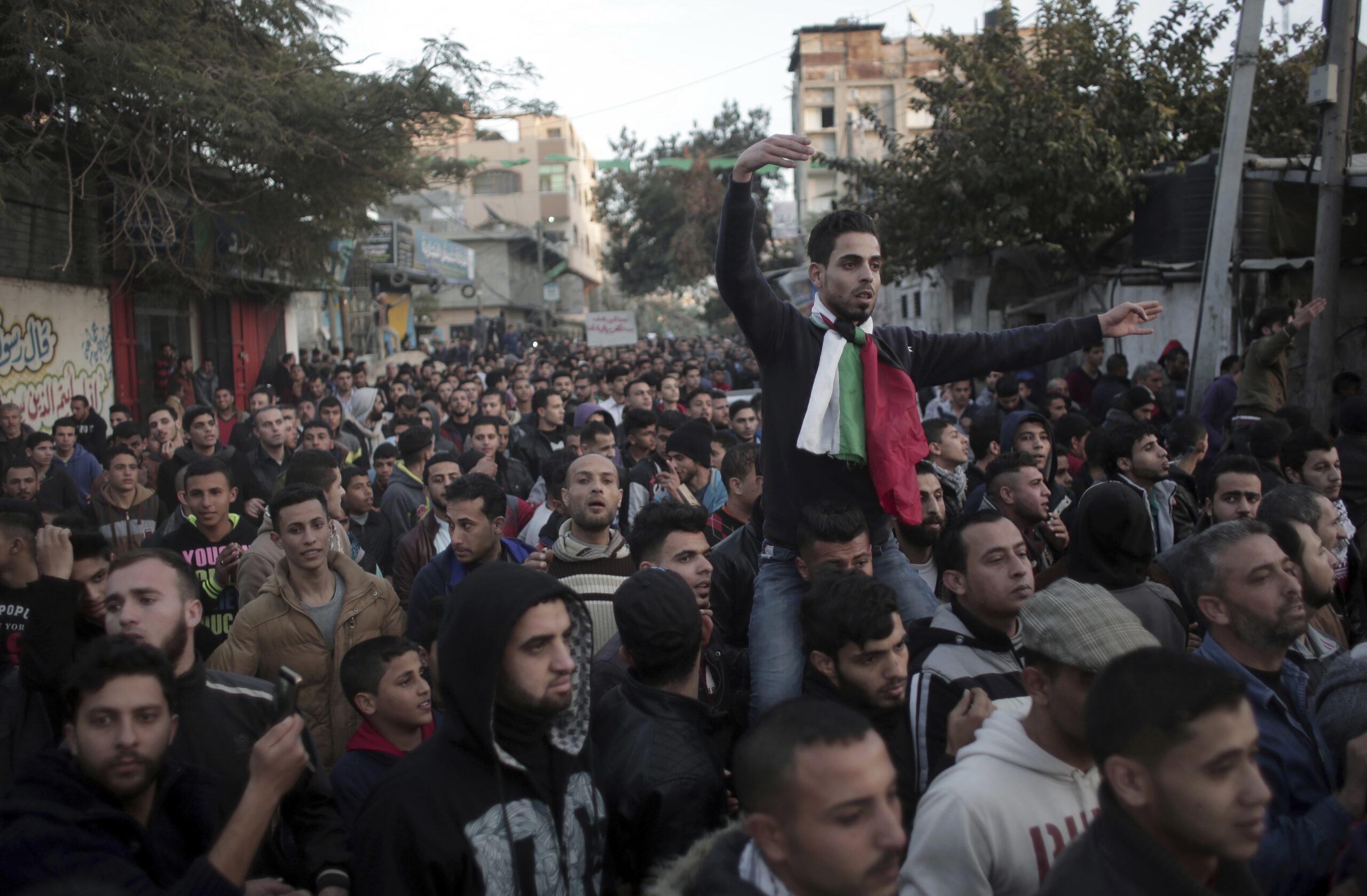 Palestinians chant slogans during a demonstration against the chronic power cuts in Jabaliya refugee camp, Northern Gaza Strip, Thursday, Jan. 12, 2017.  (AP Photo/ Khalil Hamra) (AP)