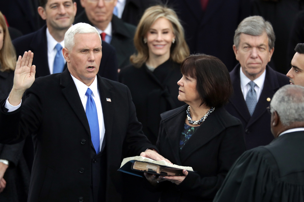 U.S. Vice President Mike Pence (L) takes the oath of office from Supreme Court Justice Clarence Thomas (R) (Getty/Chip Somodevilla)