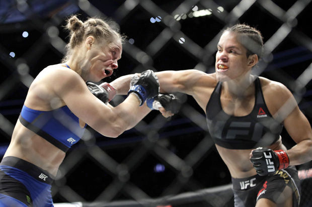 Amanda Nunes, right, connects with Ronda Rousey (AP/John Locher)