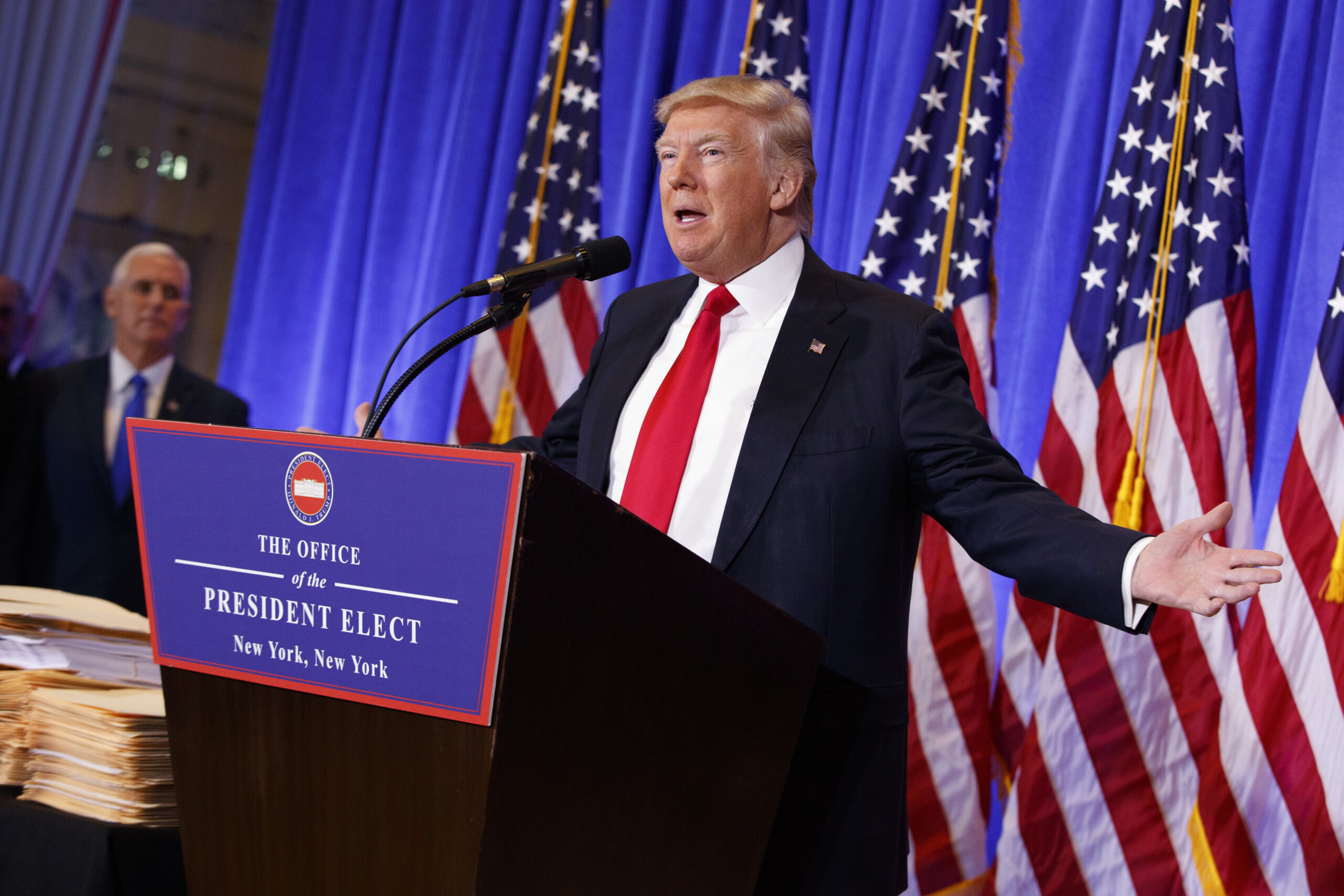 President-elect Donald Trump, accompanied by Vice President-elect Mike Pence, speaks during a news conference in the lobby of Trump Tower in New York, Wednesday, Jan. 11, 2017. (AP Photo/Evan Vucci) (AP)