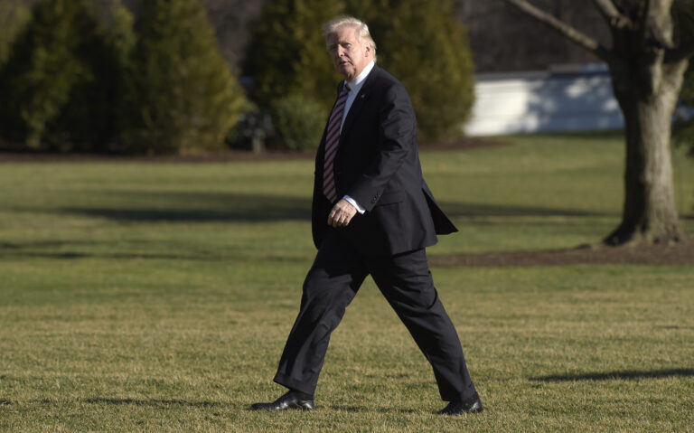 President Donald Trump walks on the South Lawn of the White House in Washington, Thursday, Jan. 26, 2017, after returning from a trip to Philadelphia. ((AP Photo/Susan Walsh))