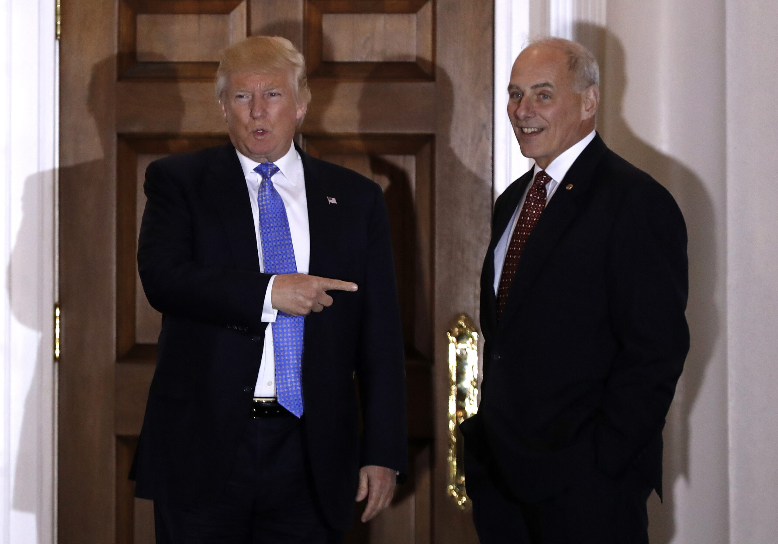 FILE - In this Nov. 20, 2016 file photo, President-elect Donald Trump talks to media as he stands with  retired Marine Gen. John Kelly at the Trump National Golf Club Bedminster clubhouse in Bedminster, N.J. Kelly is likely to be pressed about plans to build a border wall and other steps to boost immigration security at a Senate confirmation hearing on Jan. 10, for President-elect Donald Trump’s pick for Homeland Security secretary. (AP Photo/Carolyn Kaster, File) (AP)
