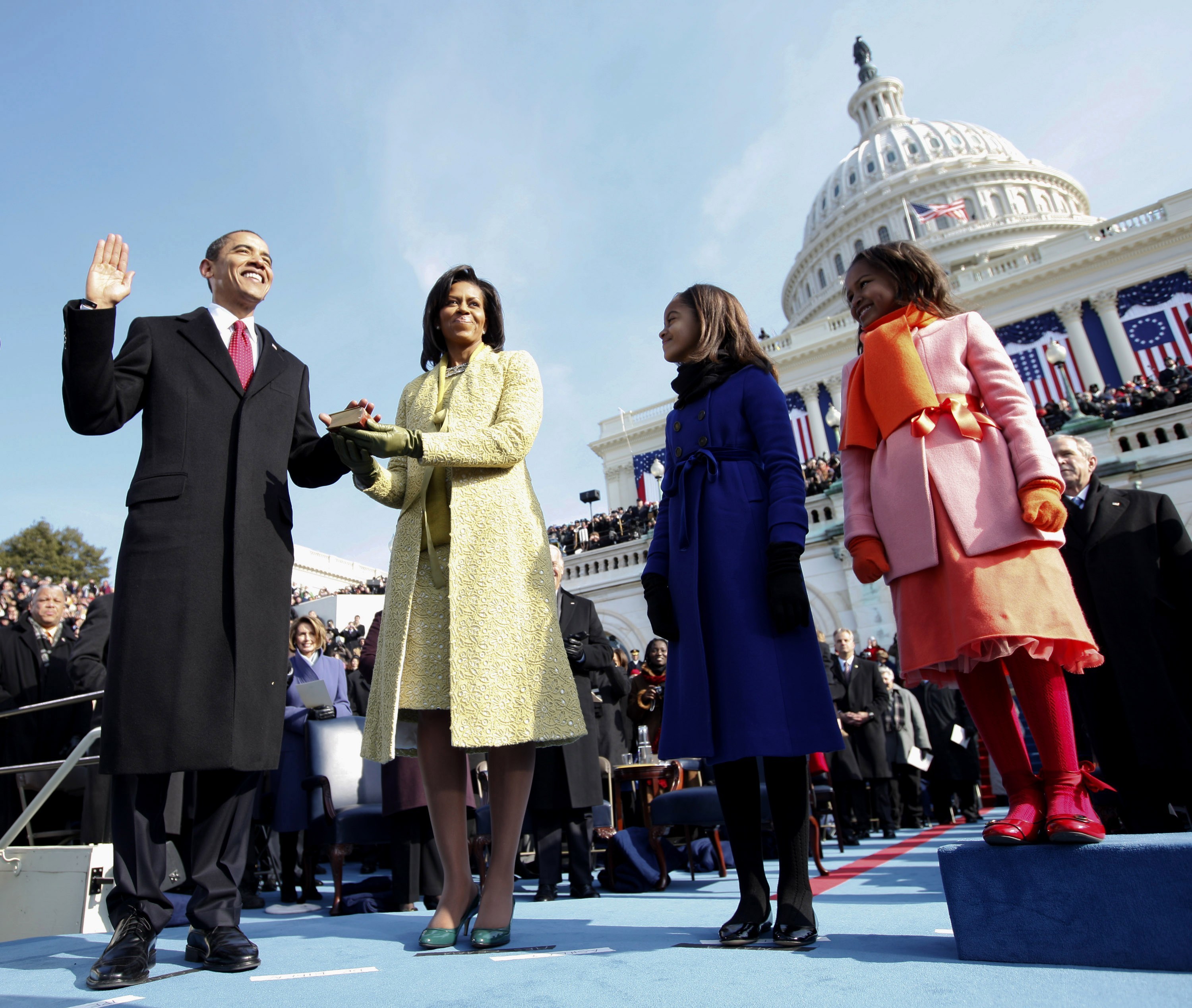 FILE - In this Jan. 20, 2009, file photo, Barack Obama, left, takes the oath of office from Chief Justice John Roberts, not seen, as his wife Michelle, holds the Lincoln Bible and daughters Sasha, right and Malia, watch at the U.S. Capitol in Washington. Donald Trump will be following some giant footsteps when he gives his inaugural speech. (AP Photo/Chuck Kennedy, Pool) (AP)