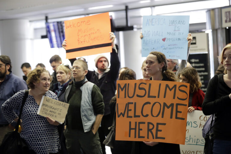 Protesters holds signs at San Francisco International Airport to denounce President Donald Trump's executive order that bars citizens of seven predominantly Muslim-majority countries from entering the U.S., Monday, Jan. 30, 2017, in San Francisco. () (AP Photo/Marcio Jose Sanchez)