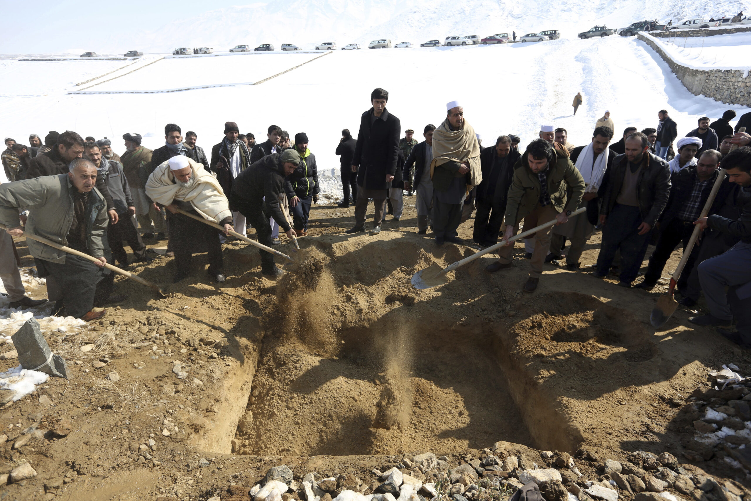 Men bury a victim of a suicide attack on the Supreme Court in Kabul, Afghanistan, Wednesday, Feb. 8, 2017. (AP)