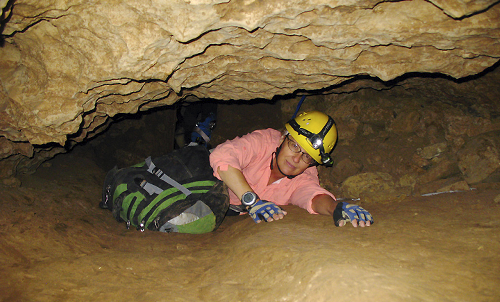 FILE - In this July 3, 2008, file photo, New Mexico Tech professor Penny Boston crawls through the Mud Turtle Passage on the way to the Snowy River formation during an expedition in Fort Stanton Cave, N.M. Boston, who discovered extreme life in New Mexico caves in 2008, presented new findings on Friday, Feb. 17, 2017 of microbes trapped in crystals in Mexico that could be 50,000 years old. (AP Photo/Susan Montoya Bryan) (AP)