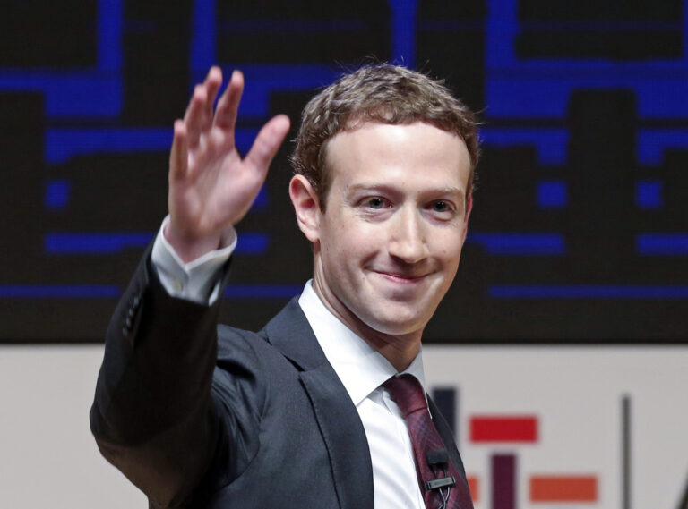 FILE - In this Nov. 19, 2016 file photo, Mark Zuckerberg, chairman and CEO of Facebook, waves at the CEO summit during the annual Asia Pacific Economic Cooperation (APEC) forum in Lima, Peru. Zuckerberg released a missive Thursday, Feb. 16, 2017, outlining his vision for the social network and the world at large. (AP Photo/Esteban Felix, File)