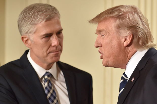 Neil Gorsuch shakes hands with Donald Trump after he was nominated for the Supreme Court, at the White House in Washington, DC, on January 31, 2017. (Getty/Nicholas Kamm)