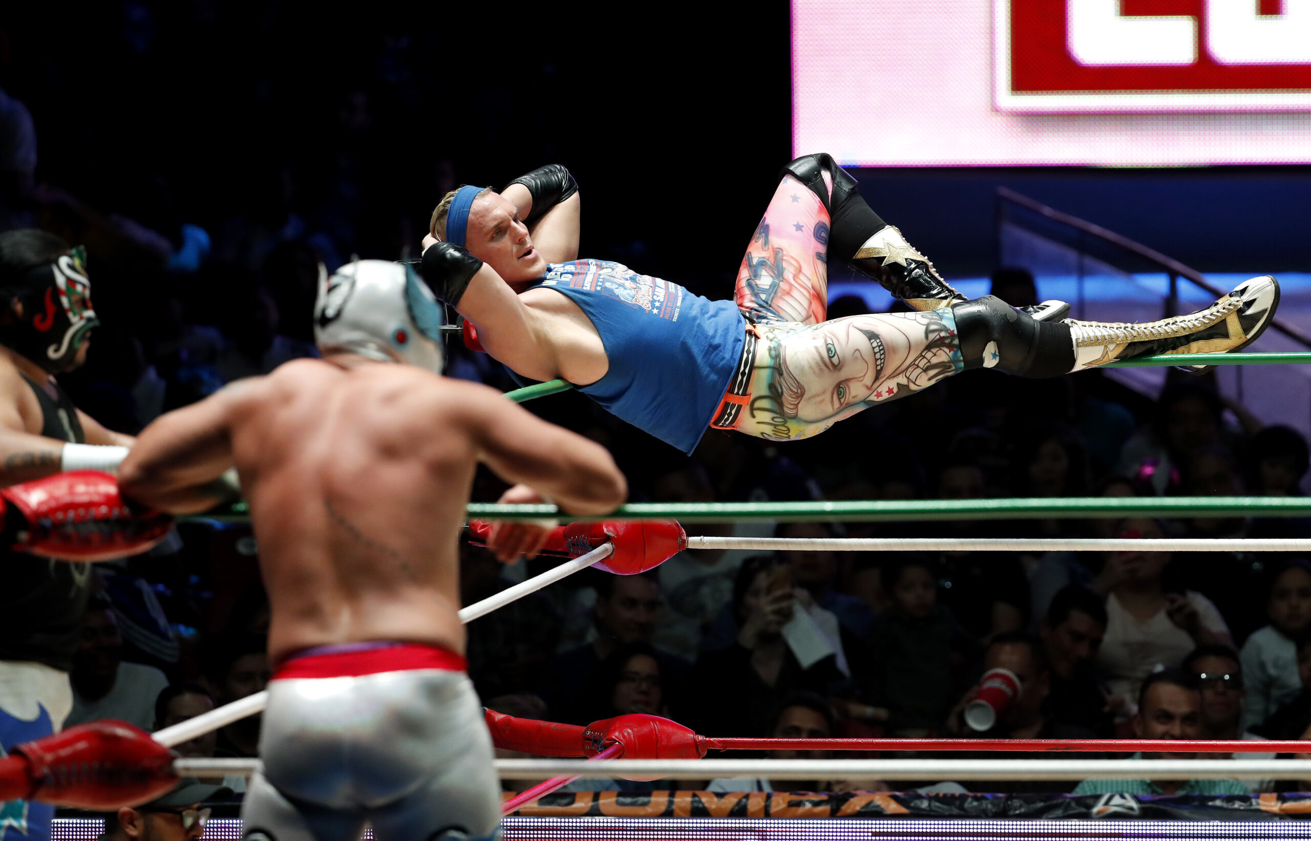 Pro wrestler Sam Polinsky working under the name of Sam Adonis balances himself on the corner ropes during a bout at Arena Mexico in Mexico City, Sunday, Feb. 12, 2017. A native of Pittsburgh, Polinsky came to Mexico last year and the Trump campaign gave him the unparalleled chance to play the ultimate ring villain. "What they want to say to Donald Trump they can say to me and feel good about it," he says. (AP Photo/Eduardo Verdugo) (AP)