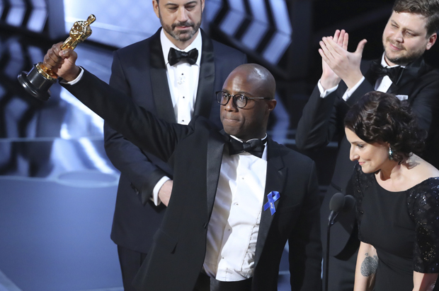 Barry Jenkins of "Moonlight" holds up the Best Picture Oscar at the 89th Academy Awards in Los Angeles. (Reuters/Lucy Nicholson)