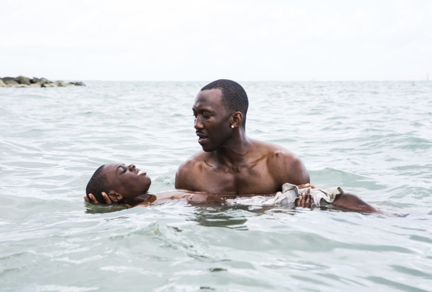 This image released by A24 shows Alex Hibbert, foreground, and Mahershala Ali in a scene from the film, "Moonlight." (David Bornfriend/A24 via AP) (AP)