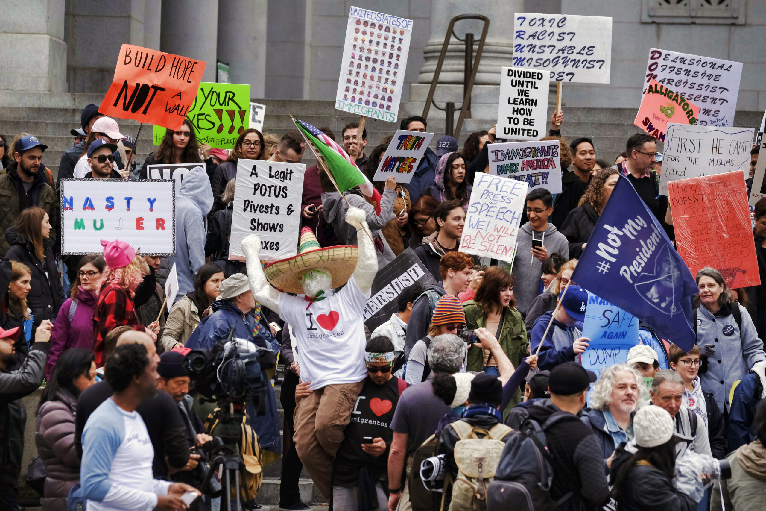 Protesters stand on the steps of Los Angeles City Hall on Monday, Feb. 20, 2017. Demonstrators gathered to express their opposition to President Donald Trump and take part in a ''Not My President's Day'' rally. (AP Photo/Richard Vogel) (AP)