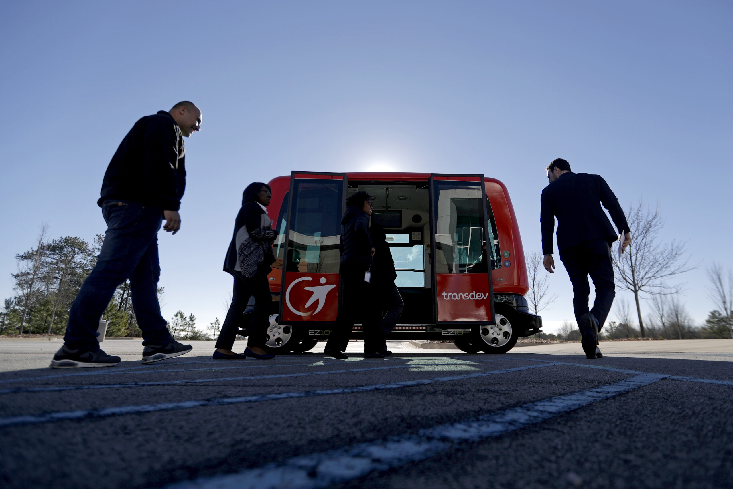 In this Thursday, Jan. 26, 2017 photo, a driverless shuttle sits on display at the Riverside EpiCenter in Austell, Ga. Self-driving vehicles could begin tooling down a bustling Atlanta street full of cars, buses, bicyclists and college students, as the city vies with other communities nationwide to test the emerging technology. (AP Photo/David Goldman) (AP Photo/David Goldman)