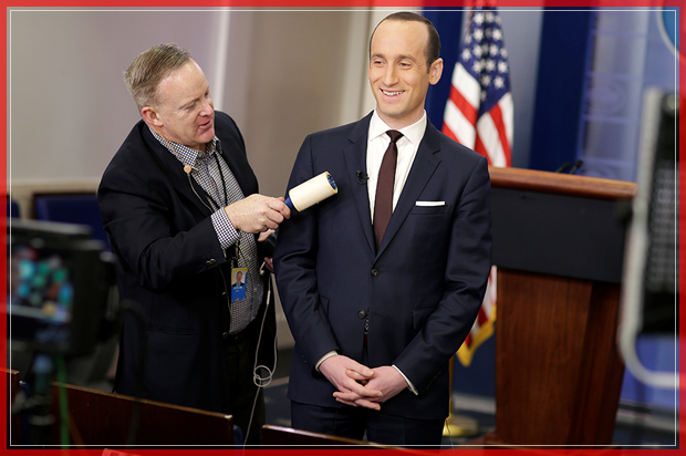 White House Press Secretary Sean Spicer removes lint from Senior White House Advisor Stephen Miller's jacket as he waits to go on the air in the White House Briefing Room in Washington, U.S., February 12, 2017. REUTERS/Joshua Roberts TPX IMAGES OF THE DAY - RTSYA0N (Reuters)