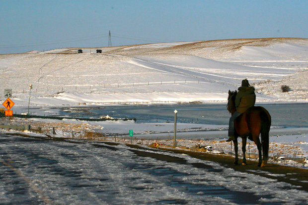 A lone water protector surveys the now-empty Standing Rock Oceti Sakowin camp. (Salon/Charlie May)