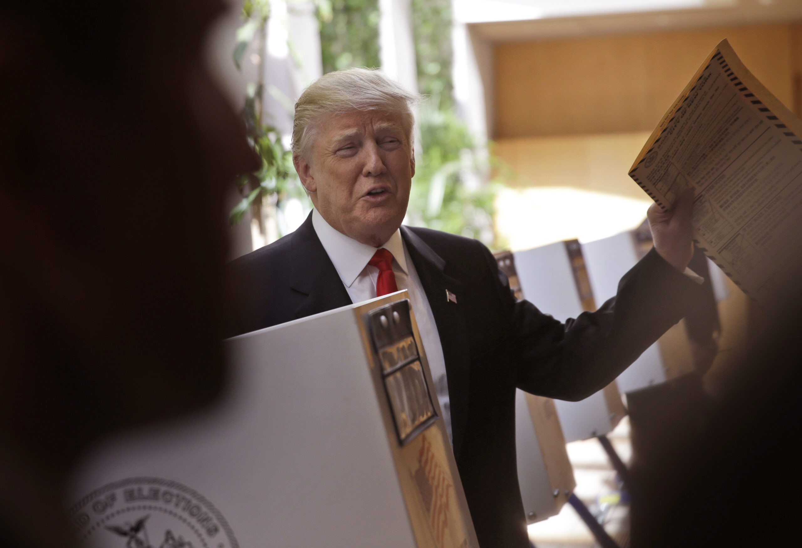 FILE- In this April 19, 2016 file photo, Republican presidential candidate Donald Trump votes in New York. After an independent review found that the city’s voting lists contained people who were dead or in prison, elections officials began an aggressive housecleaning purge in 2014. It wound up eliminating more than 200,000 supposedly invalid voting registrations. The bungled purge offers a cautionary tale for elected officials, led by President Donald Trump, who warn that inaccurate voter rolls lead to fraud. (AP Photo/Seth Wenig, File) (AP)