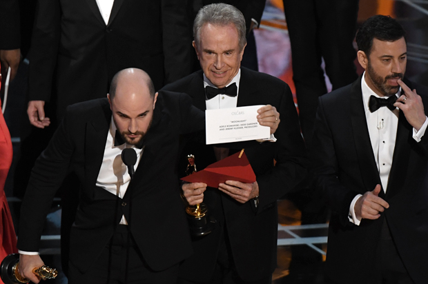 Warren Beatty shows the card reading Best Film 'Moonlight" after mistakingly reading "La La Land" initially at the 89th Oscars on February 26, 2017 in Hollywood, California. (Getty/Mark Ralston)