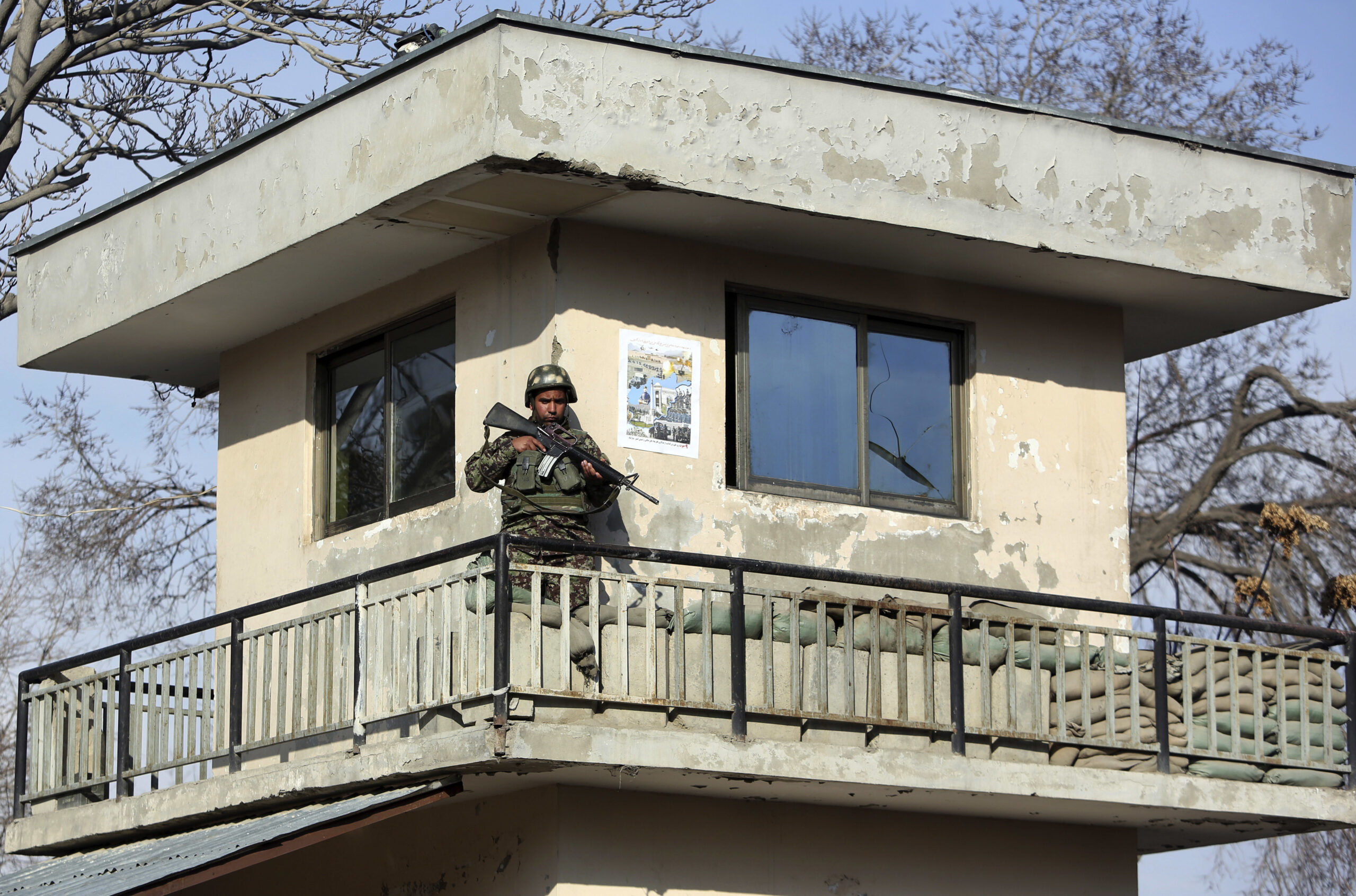 An Afghan soldier stands guard at a military hospital after an attack in Kabul, Afghanistan, Wednesday, March 8, 2017. (AP Photo/Rahmat Gul) (AP)