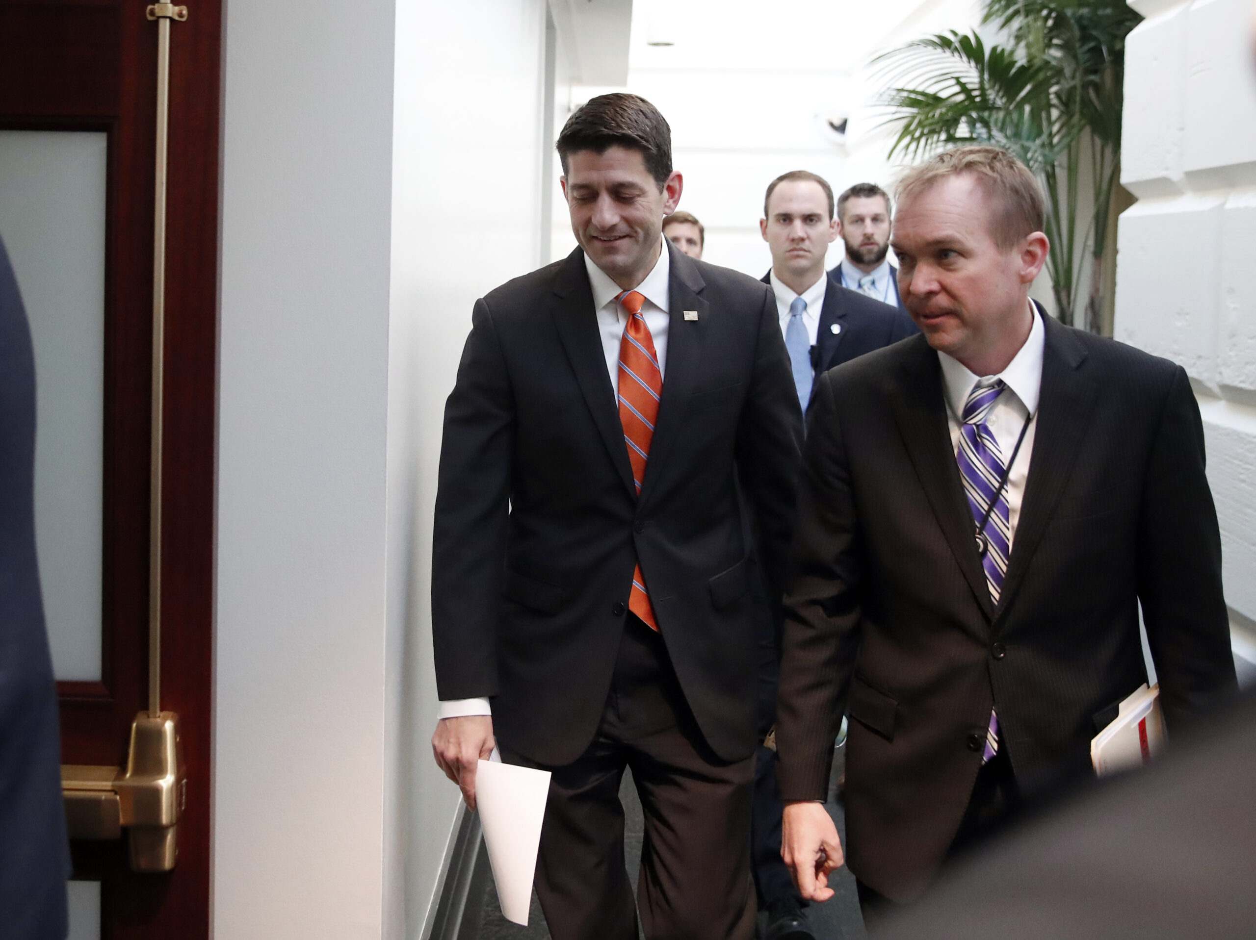 House Speaker Paul Ryan of Wis. left, and director of the Office of Management and Budget Mick Mulvaney arrive for a Republican caucus meeting on Capitol Hill, Thursday, March 23, 2017, in Washington. () (AP Photo/Alex Brandon)