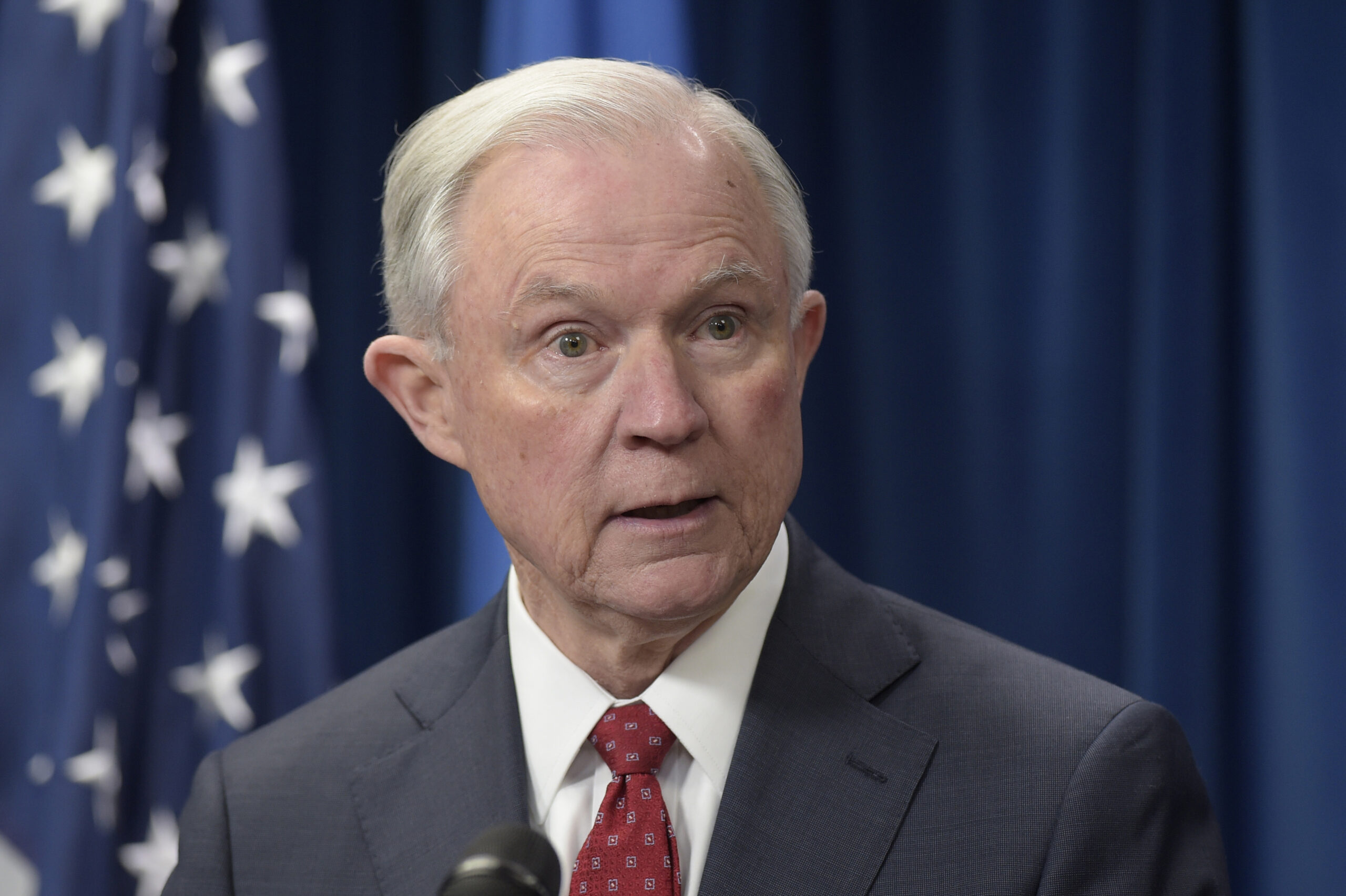 (FILE - In a Monday, March 6, 2017 file photo, Attorney General Jeff Sessions makes a statement on issues related to visas and travel, at the U.S. Customs and Border Protection office in Washington. On Wednesday, March 8, two days before Sessions gave dozens of the country's top federal prosecutors just hours to resign and clean out their desks, he gave those political appointees a pep talk during a conference call.  (AP Photo/Susan Walsh, File)