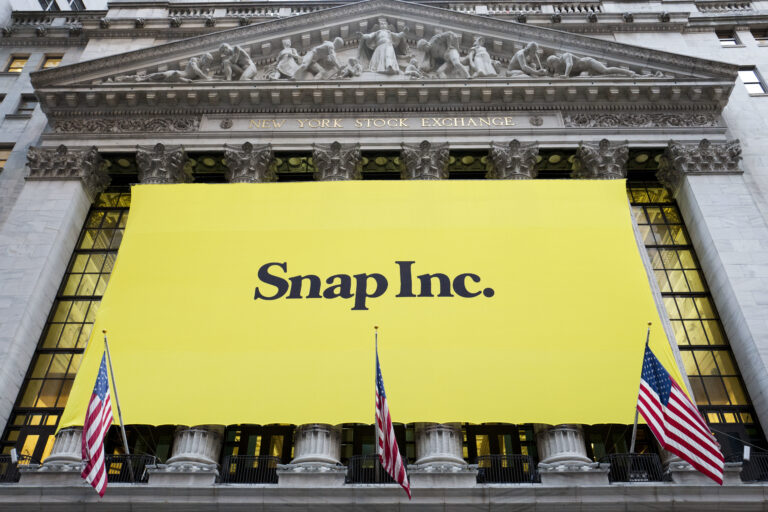 A banner for Snap Inc. hangs from the front of the New York Stock Exchange, Thursday, March 2, 2017, in New York. The company behind the popular messaging app Snapchat is expected to start trading Thursday after a better-than-expected stock offering. (AP Photo/Mark Lennihan) (AP)