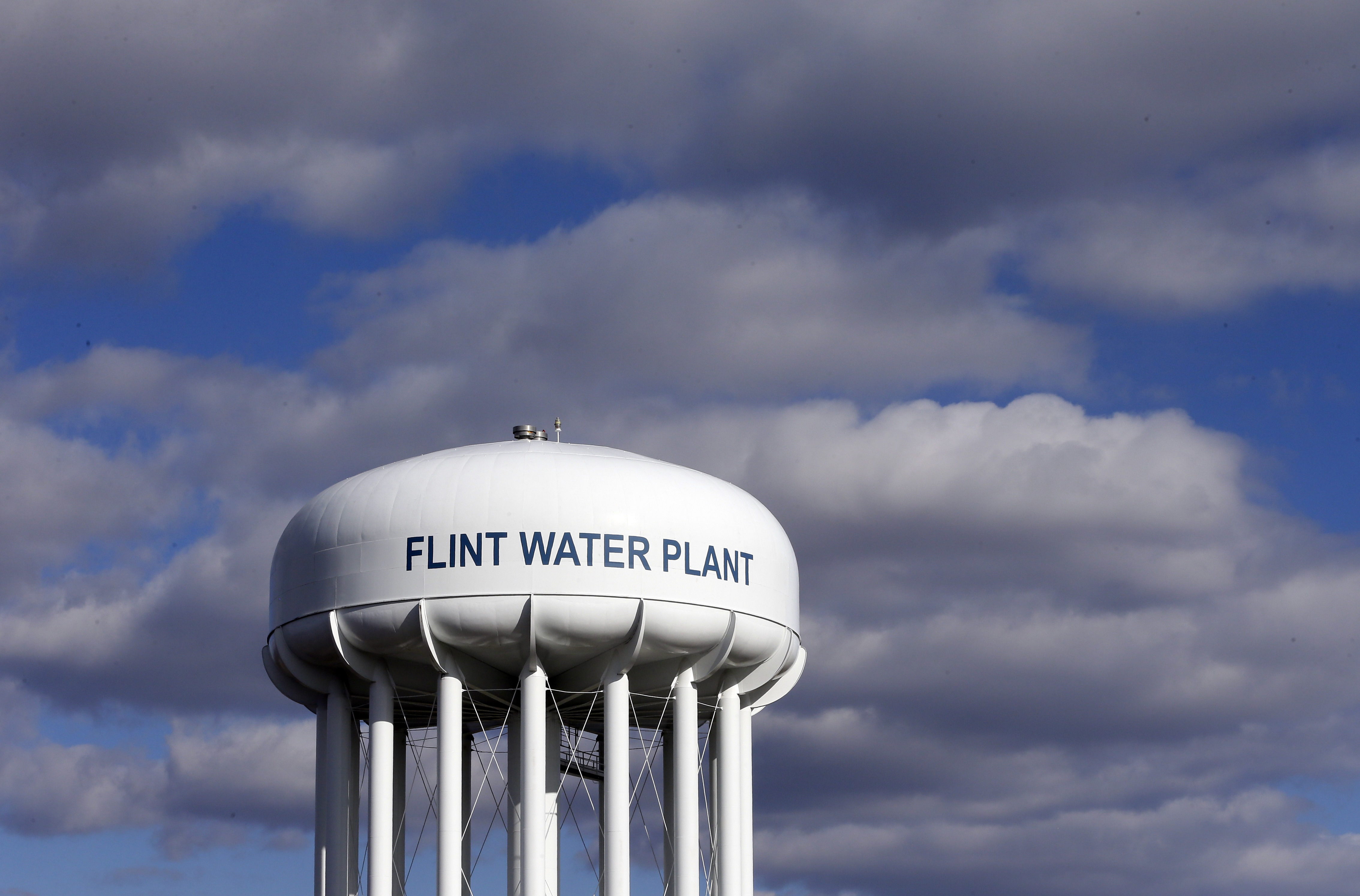FILE - In this March 21, 2016 file photo, the Flint Water Plant water tower is seen in Flint, Mich. The Trump administration would slash programs aimed at slowing climate change and improving water safety and air quality, while eliminating thousands of jobs, according to a draft of the Environmental Protection Agency budget proposal obtained by the Associated Press.  (AP Photo/Carlos Osorio, File) (AP)