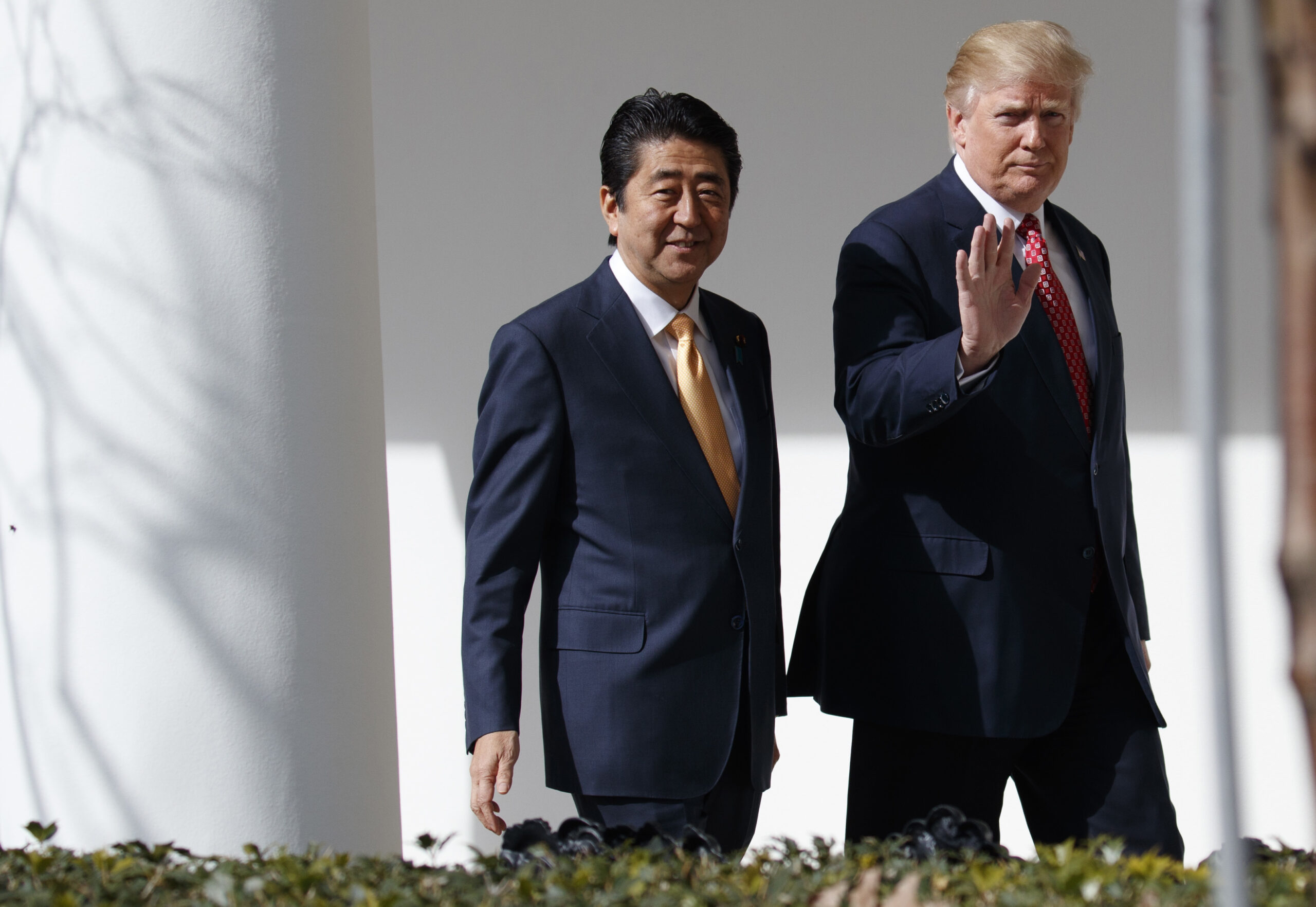 FILE - In this Feb. 10, 2017, file photo, Japanese Prime Minister Shinzo Abe, left, and U.S. President Donald Trump walk together to a news conference at the White House in Washington. (AP Photo/Evan Vucci, File)