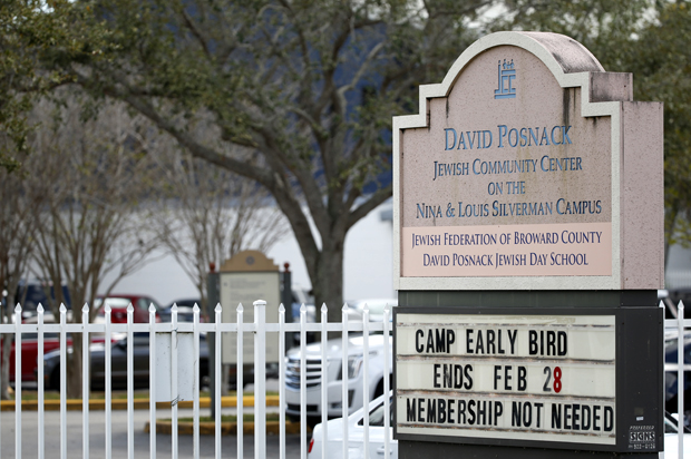 A sign outside the entrance to the David Posnack Jewish Community Center and David Posnack Jewish Day School is shown after people were evacuated because of a bomb threat, Monday, Feb. 27, 2017, in Davie, Fla. (AP/Wilfredo Lee)