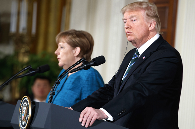 Donald Trump looks and Angela Merkel at a news conference in the White House, March 17, 2017. (AP/Evan Vucci)