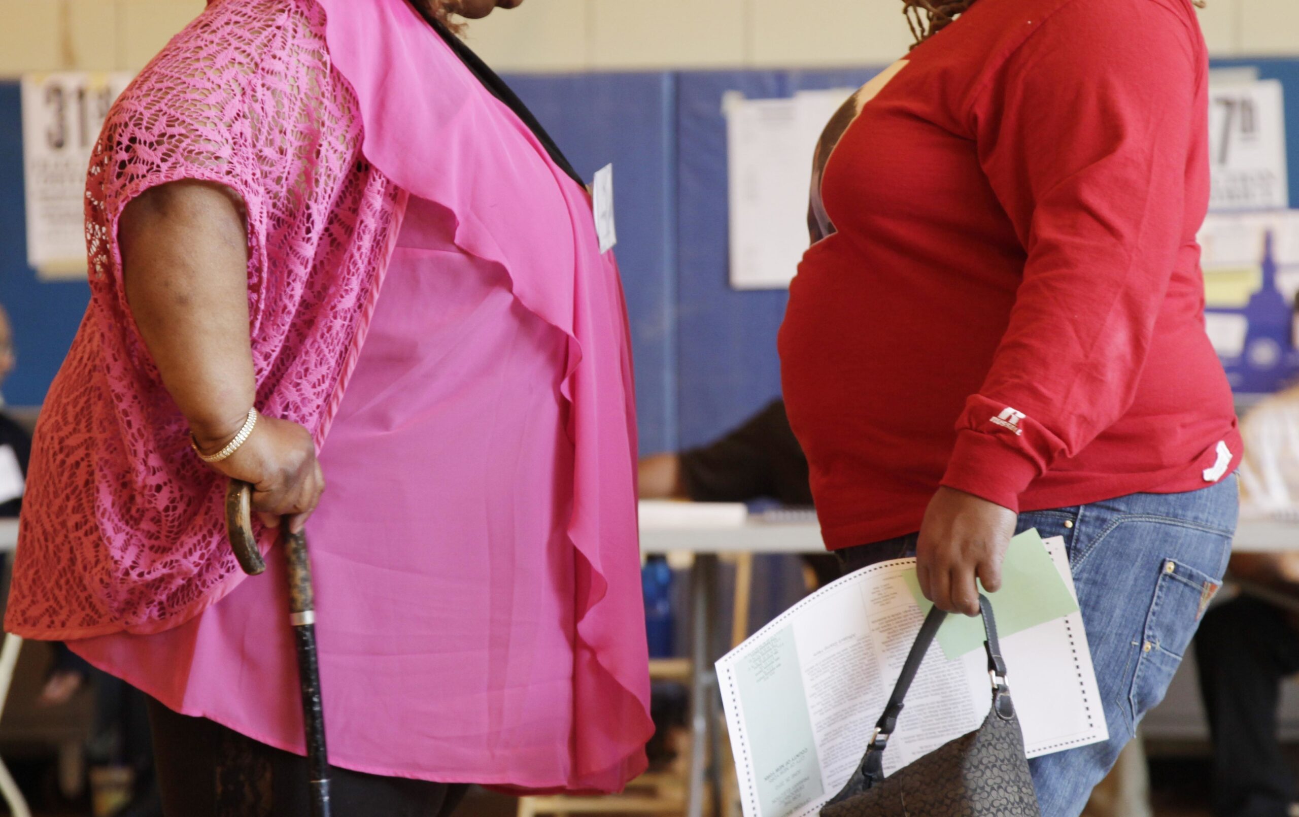 FILE - In this June 26, 2012, file photo, two women converse in New York. "Socially accepted normal body weight is shifting toward heavier weight. As more people around us are getting heavier, we simply believe we are fine, and no need to do anything with it," said Dr. Jian Zhang, a public health researcher at Georgia Southern University and the lead author in a study released on Tuesday, March 7, 2017. (AP Photo/Mark Lennihan, File) (AP)