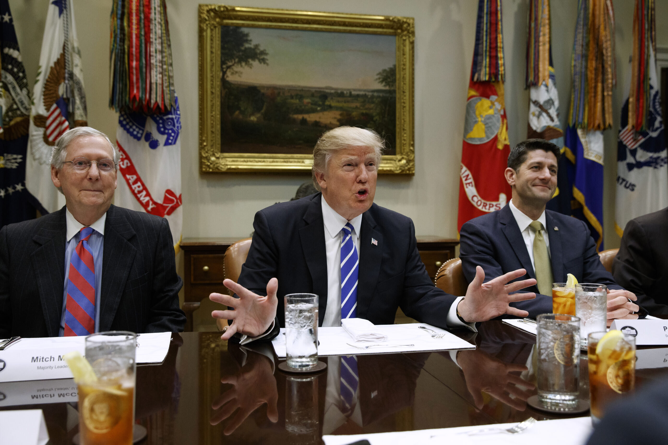 President Donald Trump, flanked by Senate Majority Leader Mitch McConnell of Ky., left, and House Speaker Paul Ryan of Wis., speaks during a meeting with House and Senate leadership, Wednesday, March 1, 2017, in the Roosevelt Room of the White House in Washington. () (AP Photo/Evan Vucci)