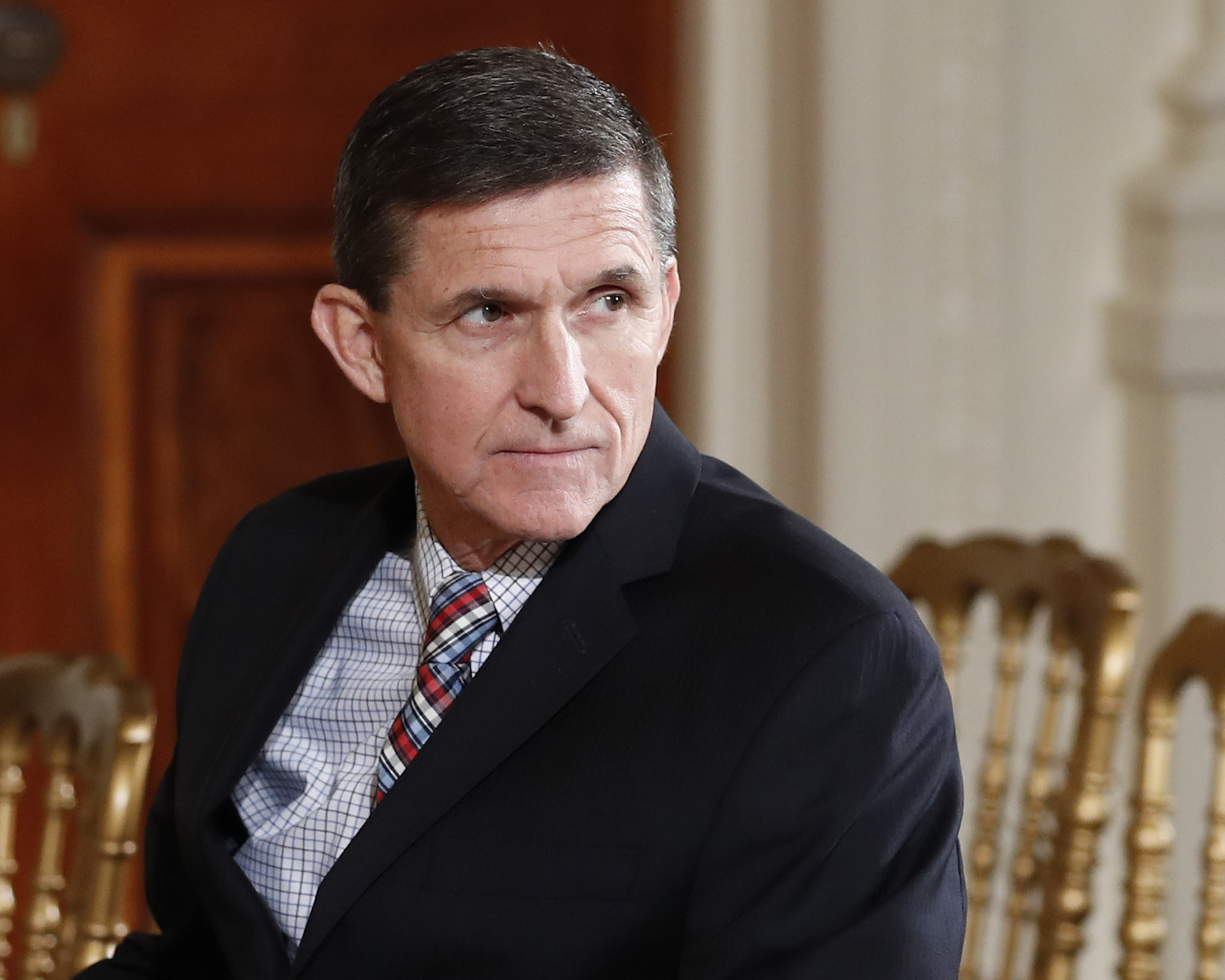 FILE - In this Feb. 10, 2017 file photo, then-National Security Adviser Michael Flynn sits in the East Room of the White House in Washington. Former CIA Director James Woolsey has accused former Trump administration National Security Adviser Michael Flynn of participating in a discussion with Turkish officials in which the possibility of subverting the U.S. extradition process to remove a Turkish cleric from the U.S.  The Wall Street Journal first reported Woolsey’s comments and posted a video interview with him late Friday.  A Flynn spokesman said Friday that Woolsey’s claims were “false” and that “no such discussion occurred.”   (AP Photo/Carolyn Kaster, File) (AP)