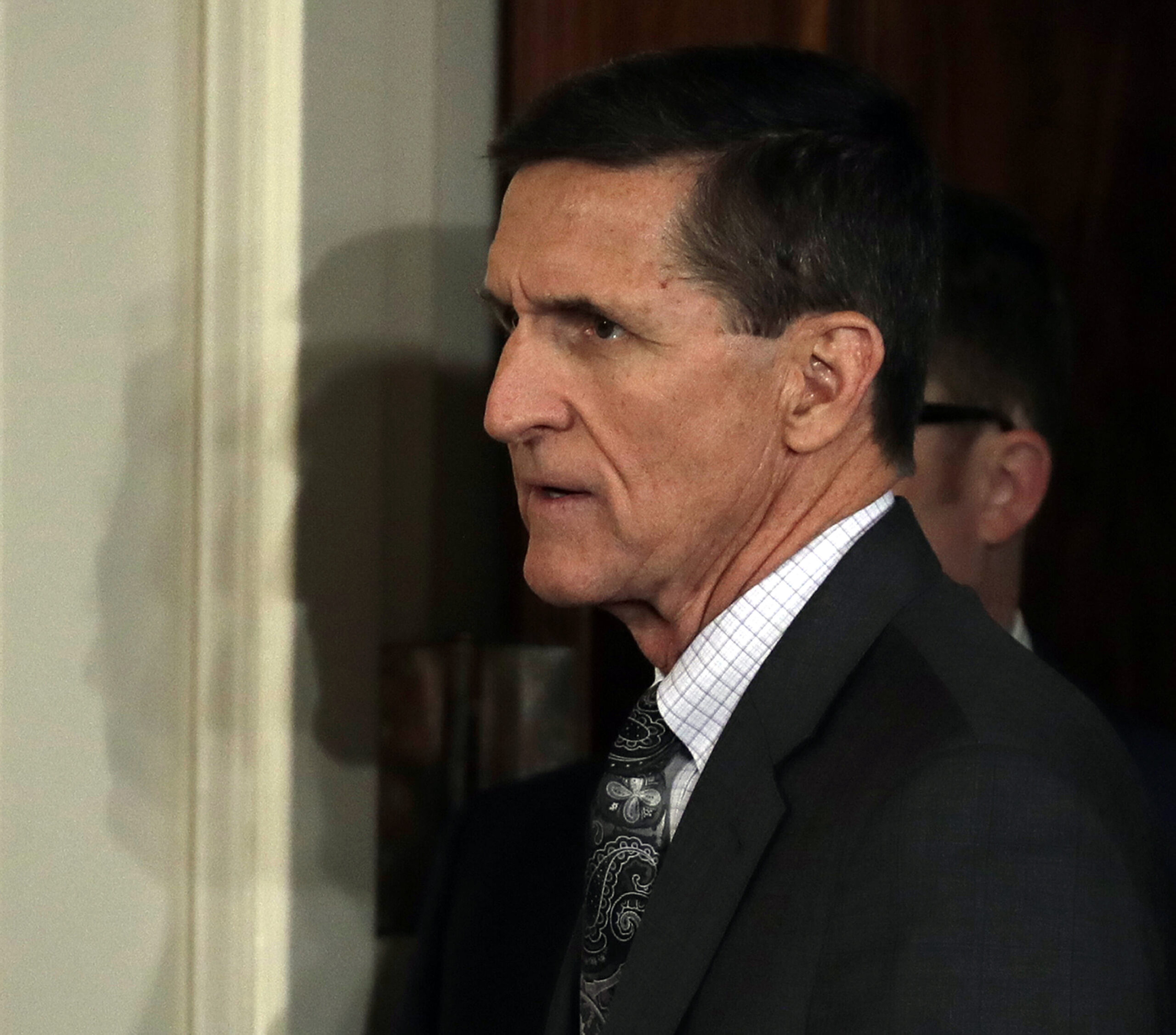 FILE - In this Feb. 13, 2017, file photo, then-National Security Adviser Michael Flynn arrives in the east Room of the White House in Washington, Monday, Feb. 13, 2017, for a news conference with President Donald Trump.  President Donald Trump’s administration remains under scrutiny over potential ties between his associates and Russia in the run-up to the presidential election. Trump has denied knowing that any of his staff had communications with Russian officials during the campaign. But congressional probes are underway, and the FBI is investigating. (AP Photo/Evan Vucci, File) (AP)