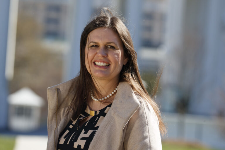 In this March 8, 2017, photo, White House deputy press secretary Sarah Huckabee Sanders stands in front of the White House in Washington. Faced with aggressive on-air questioning about the president’s wiretapping claims, Sarah Huckabee Sanders didn’t flinch, she went folksy. The 34-year-old spokeswoman for President Donald Trump was schooled in hardscrabble politics, and down-home rhetoric, from a young age by her father, folksy former Arkansas Gov. Mike Huckabee. (AP Photo/Evan Vucci) (AP)