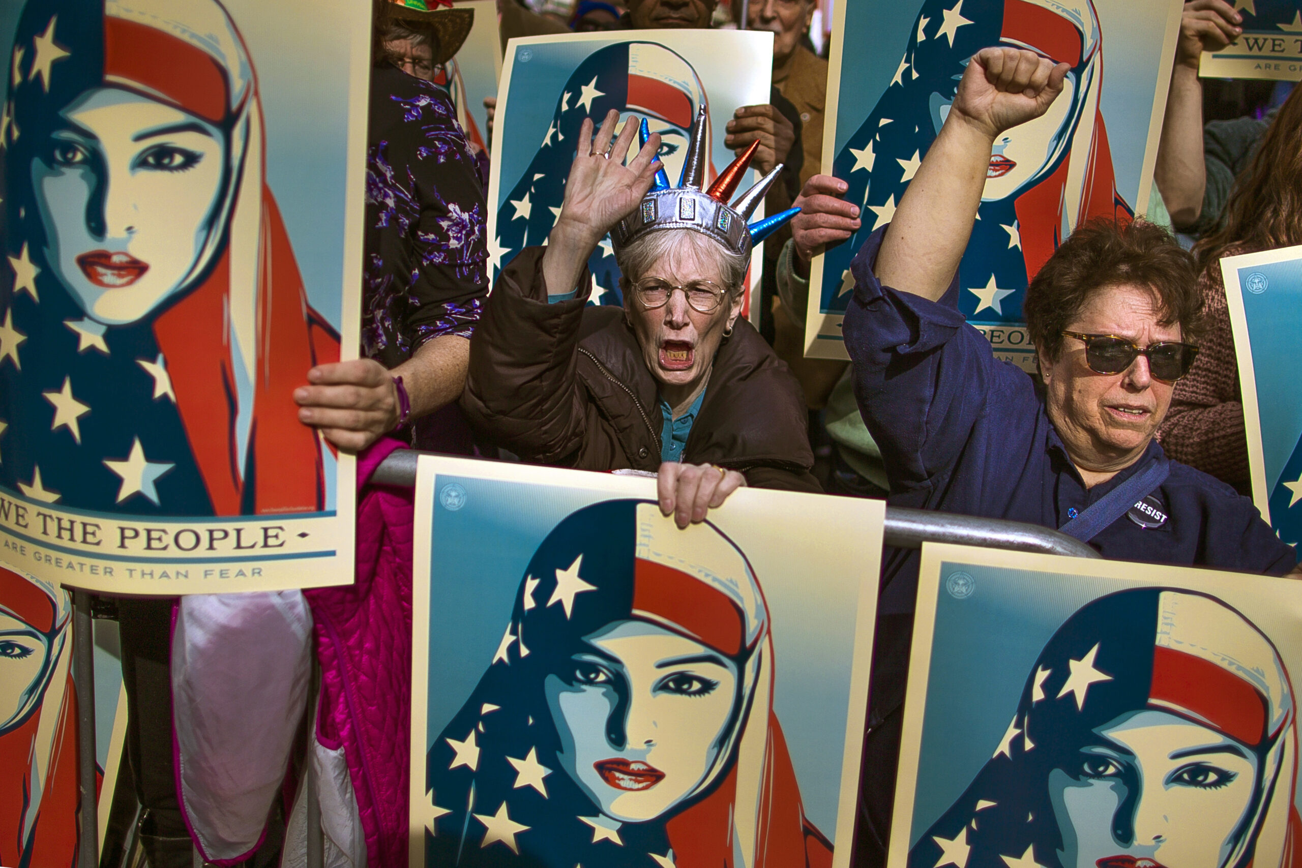 In this Feb. 19, 2017, file photo, people carry posters during a rally against President Donald Trump's executive order banning travel from seven Muslim-majority nations, in New York's Times Square. Trump’s travel ban has been frozen by the courts, but the White House has promised a new executive order that officials say will address concerns raised by judges that have put the policy on hold.
The first order was met by legal challenges, confusion at airports worldwide and mass protests, but the White House has forecast smoother sailing the second time around.  () (AP Photo/Andres Kudacki)