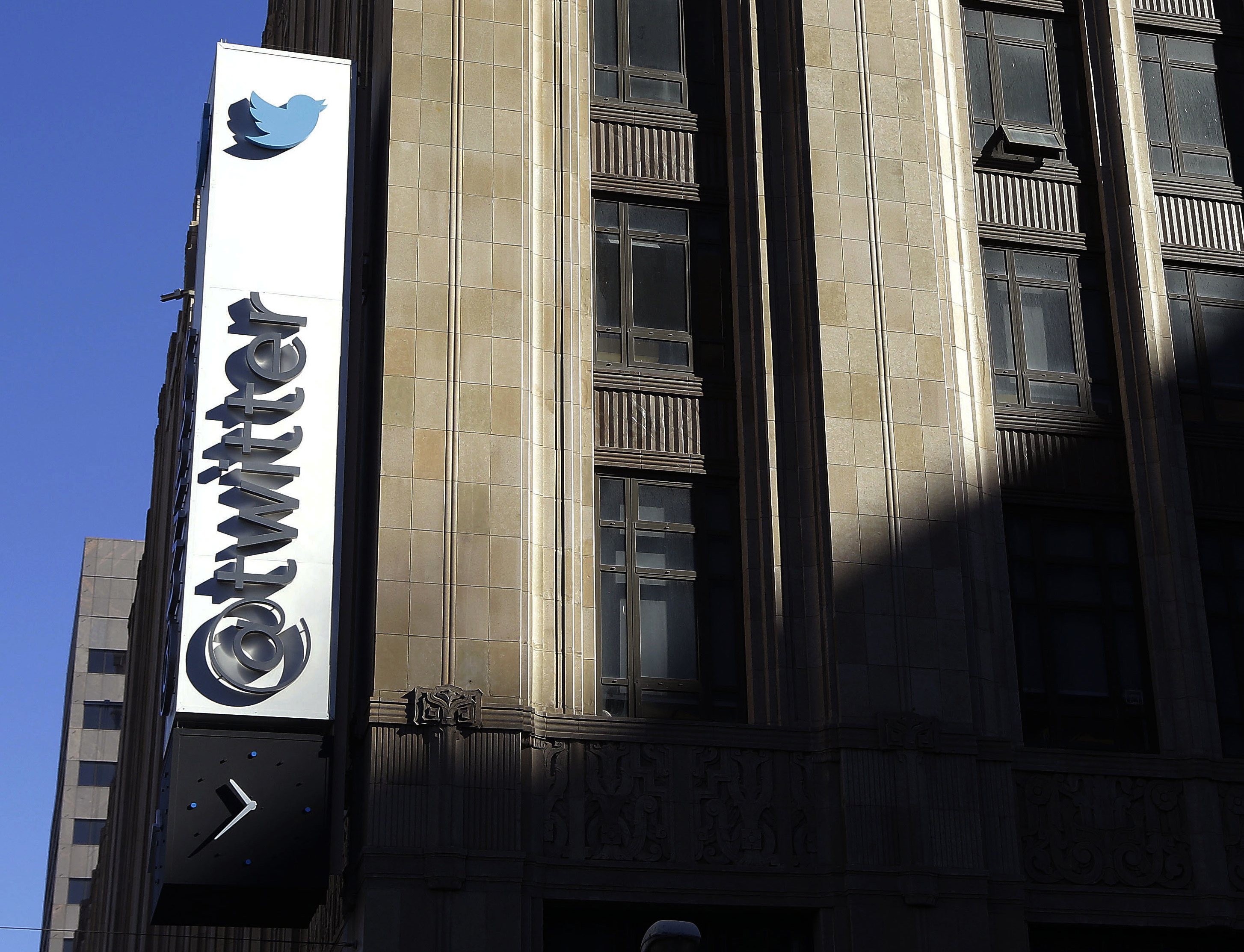 FILE - This Nov. 4, 2013, file photo shows the sign outside of Twitter headquarters in San Francisco. Twitter announced Wednesday, March 1, 2017, it is adding more new tools to curb abuse, part of an ongoing effort to protect its users from hate and harassment. It the second time in three weeks the company has released new features aimed at rooting out abusive content, signaling that it’s getting more serious about the issue after being criticized for not doing enough in the decade since its founding. (AP Photo/Jeff Chiu, File) (AP)