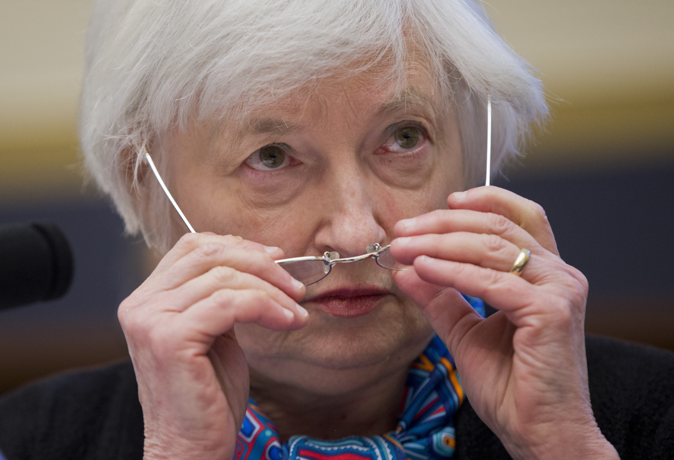 FILE - In this June 22, 2016 file photo, Federal Reserve Chair Janet Yellen adjusts her glasses as she testifies on Capitol Hill in Washington. several Federal Reserve officials have signaled in recent days that the Fed is ready to resume raising interest rates as soon as March 2017. The question is whether the official who matters most, Yellen,  will add her own voice to that impression. (AP Photo/Manuel Balce Ceneta, File) (AP)