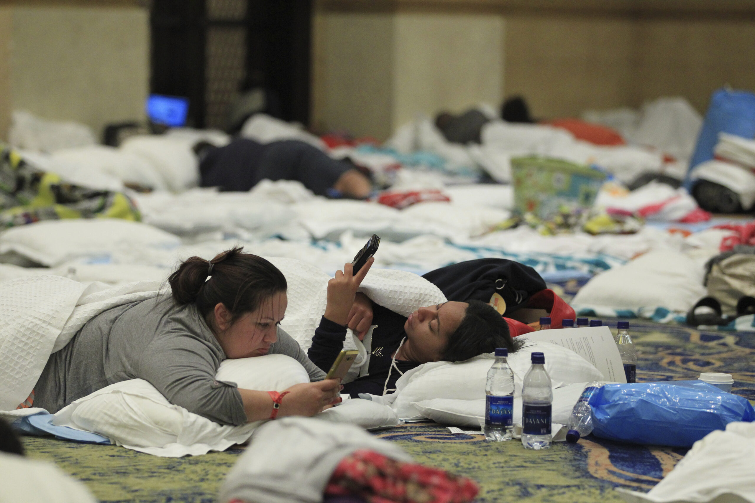 Guests try to pass the time in the ballrooms of the Atlantis Paradise Island Hotel, as Hurricane Matthew moves away from the resort island in Nassau, Bahamas, Thursday, Oct. 6, 2016. (AP Photo/Tim Aylen)