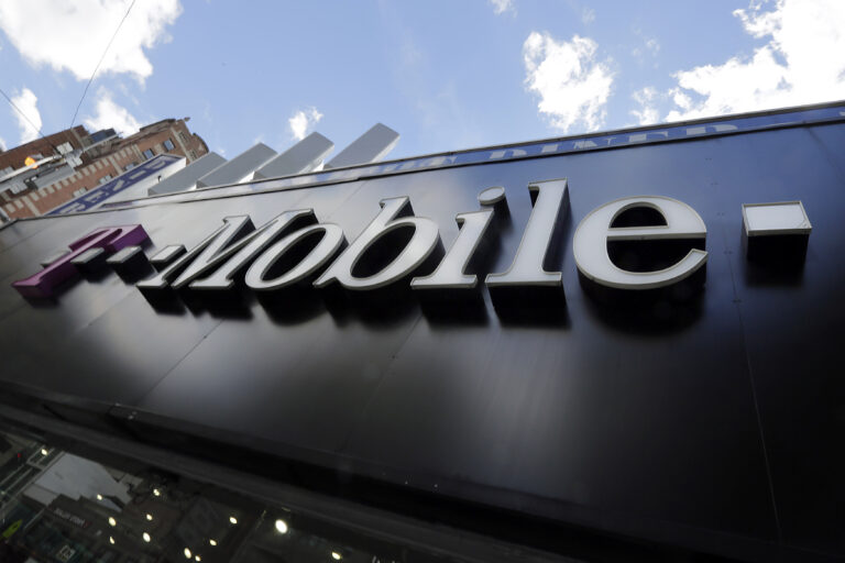 FILE - This Wednesday, Oct. 14, 2015, file photo shows a T-Mobile store in New York. Consumers could see more competition and better mobile service after the end of a big U.S. government auction transferring airwave rights from TV broadcasters to companies interested in wireless networks. The biggest spenders in the Federal Communications Commission’s $19.8 billion auction were T-Mobile with $8 billion, satellite TV company Dish at $6.2 billion and Comcast with $1.7 billion. (AP Photo/Richard Drew, File) (AP)