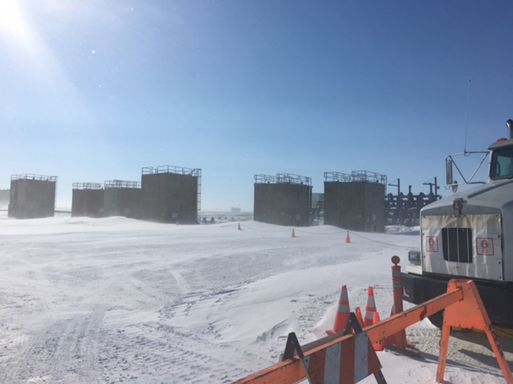 This April 2017 photo provided by the U.S. Environmental Protection Agency shows an oil well that was misting natural gas on Alaska's frozen North Slope. Workers from the Alaska Department of Conservation and the Environmental Protection Agency on Saturday, April 15, 2017, were able to connect hoses to valves that allow pressure in the well to be reduced, according to a statement from the state conservation department. The Environmental Protection Agency says a crack in the BP wellhead near Deadhorse sent up mist of crude oil Friday before it froze over and an initial leak stopped. (U.S. Environmental Protection Agency via AP) (AP)