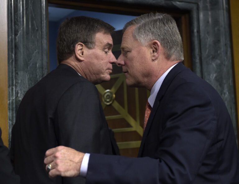 Senate Intelligence Committee Chairman Sen. Richard Burr, R-N.C., right, and the Committee's Vice Chairman Sen. Mark Warner, D-Va., stand up to leave on Capitol Hill in Washington, Thursday, March 30, 2017, following the committee's hearing on Russian intelligence activities. (AP Photo/Susan Walsh) (AP)