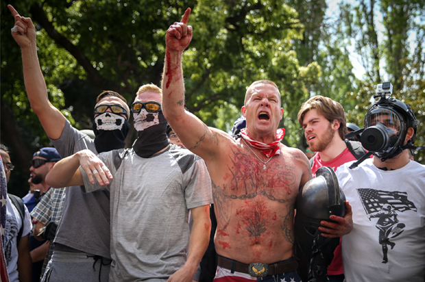 BERKELEY, CA - APRIL 15: Trump supporters face off with protesters at a "Patriots Day" free speech rally on April 15, 2017 in Berkeley, California. More than a dozen people were arrested after fistfights broke out at a park where supporters and opponents of President Trump had gathered. (Photo by Elijah Nouvelage/Getty Images) (Getty Images)