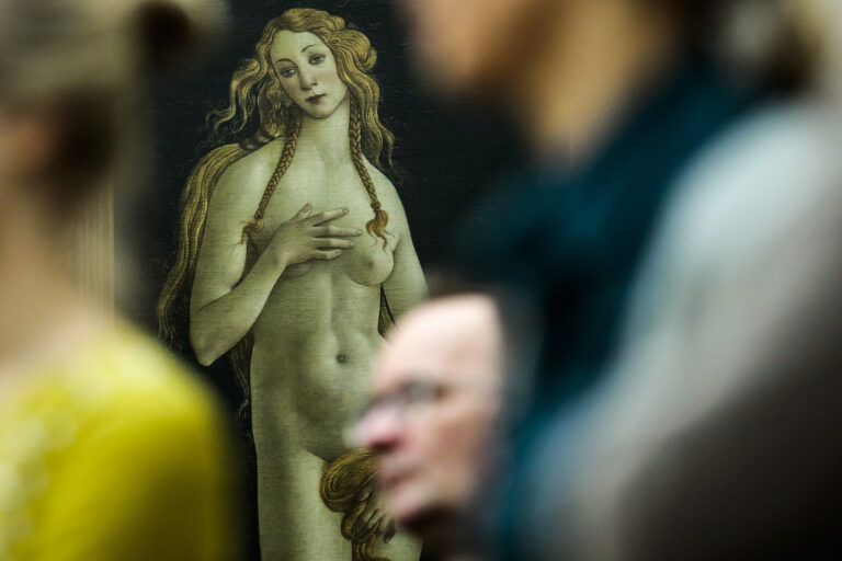 In this Thursday, Jan. 15, 2015 file photo people stand in front of the 'Venus' by Italian painter Sandro Botticelli during a news conference about the planned exhibition 'The Botticelli Renaissance' in Berlin. (AP Photo/Markus Schreiber)
