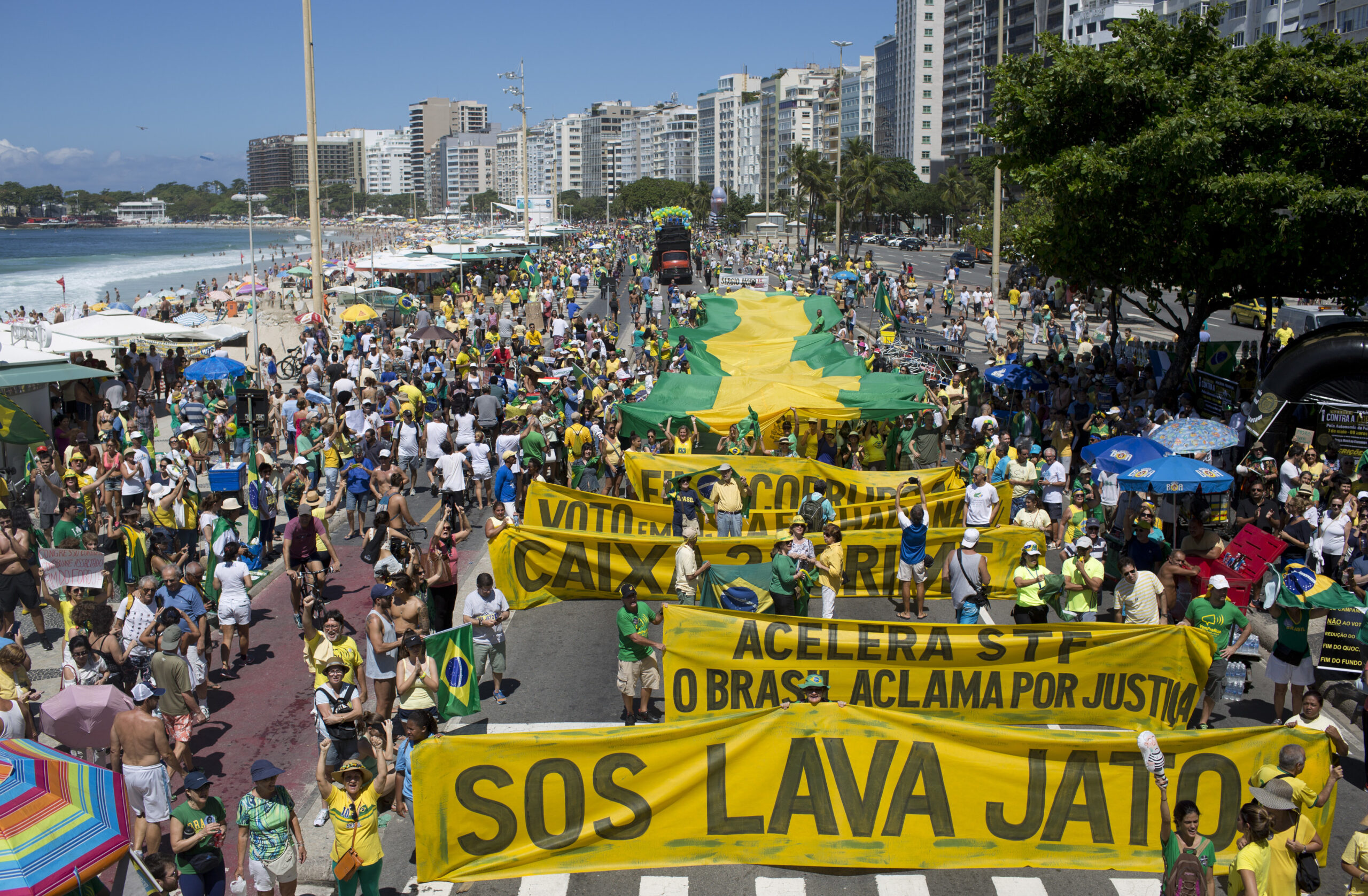 In this March 26, 2017, file photo, people march against corruption and in support of the Car Wash investigation on Copacabana beach, in Rio de Janeiro, Brazil. Three years since the so-called Car Wash investigation began, dozens of the country's elite have been jailed, and there is no end in sight. The investigation has expanded, both within Brazil and to several Latin American countries, with daily revelations about accusations of wrongdoing that threaten many political leaders. (AP Photo/Silvia Izquierdo) (AP)