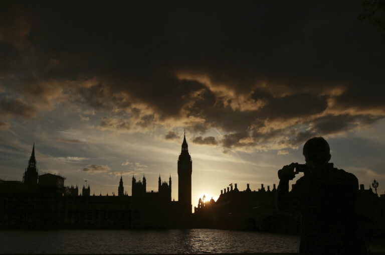 A silhouette of the Houses of Parliament and Elizabeth Tower containing Big Ben, centre, at dusk, in Westminster, London, Tuesday April 18, 2017. (Yui Mok/PA via AP)