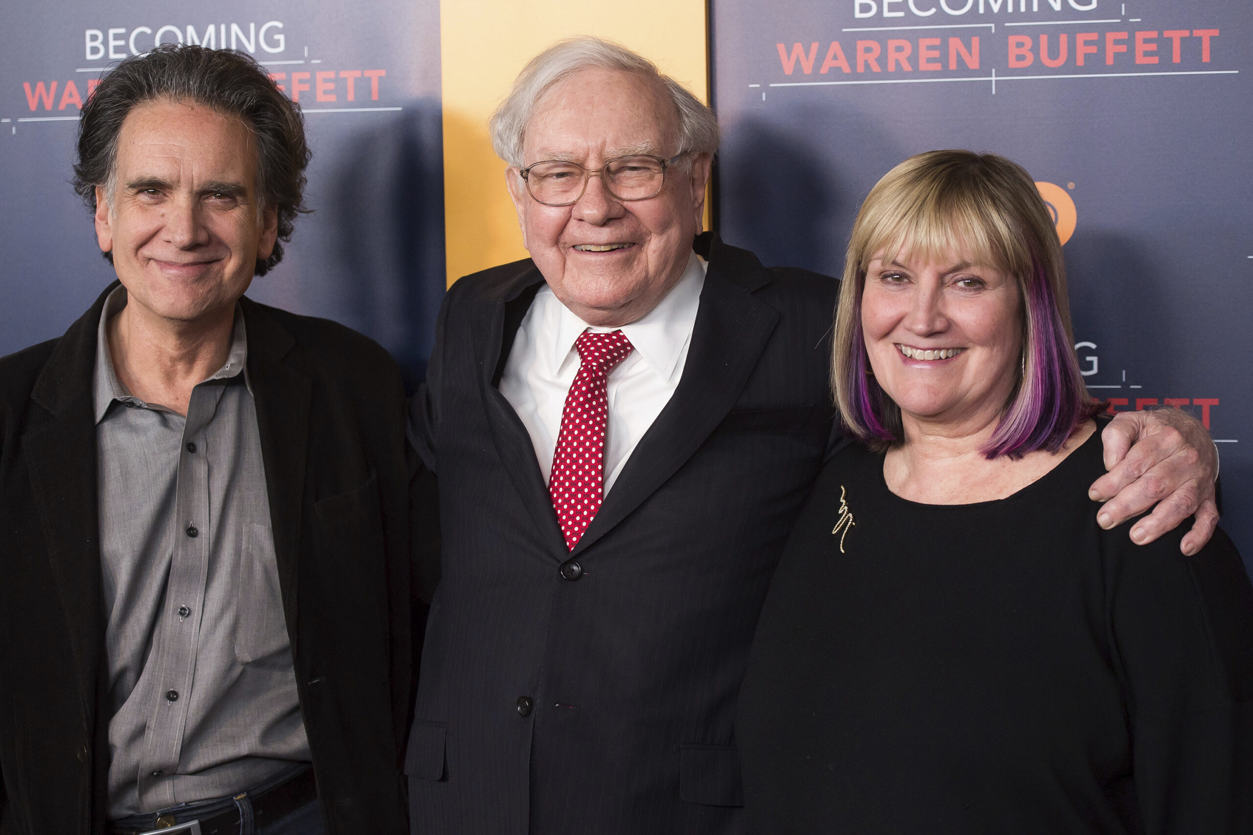 FILE - In this Thursday, Jan. 19, 2017, file photo, Peter Buffett, from left, Warren Buffett and Susie Buffett attend the world premiere screening of HBO's "Becoming Warren Buffett" at The Museum of Modern Art in New York. A foundation run by Peter, the youngest son of billionaire investor Warren Buffett, is announcing its strategy for distributing $90 million to help improve the lives of young women and girls of color in the United States. The NoVo Foundation was created in 2006 by Jennifer and Peter Buffett. (Photo by Charles Sykes/Invision/AP, File) (Charles Sykes/invision/ap)