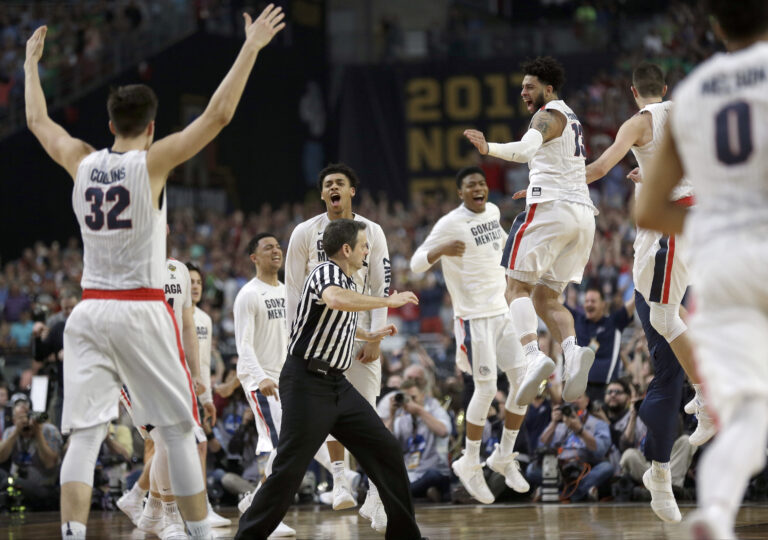 Gonzaga players celebrate after the semifinals of the Final Four NCAA college basketball tournament (AP)