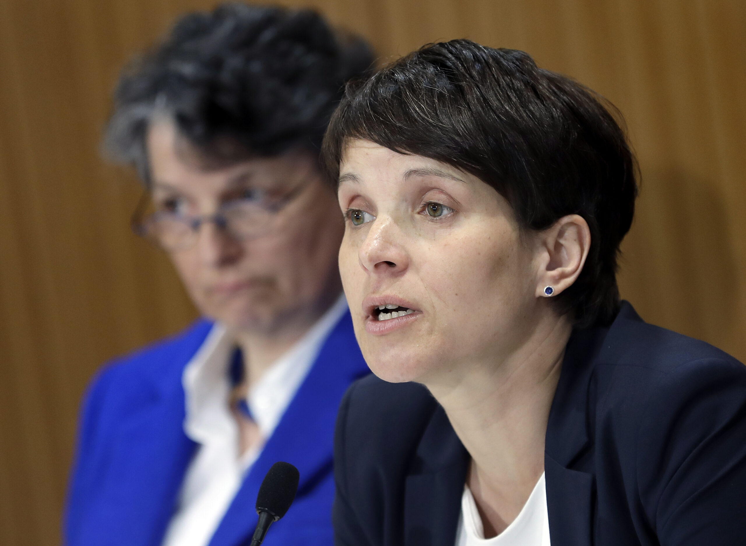 AfD (Alternative for Germany) chairwomen and party's faction leader in the German state parliament of Saxony, Frauke Petry, right, and the faction's media policy spokeswomen, Kirsten Muster, left, address the media during a press conference in Berlin, Germany, Tuesday, April 18, 2017. ((AP Photo/Michael Sohn))