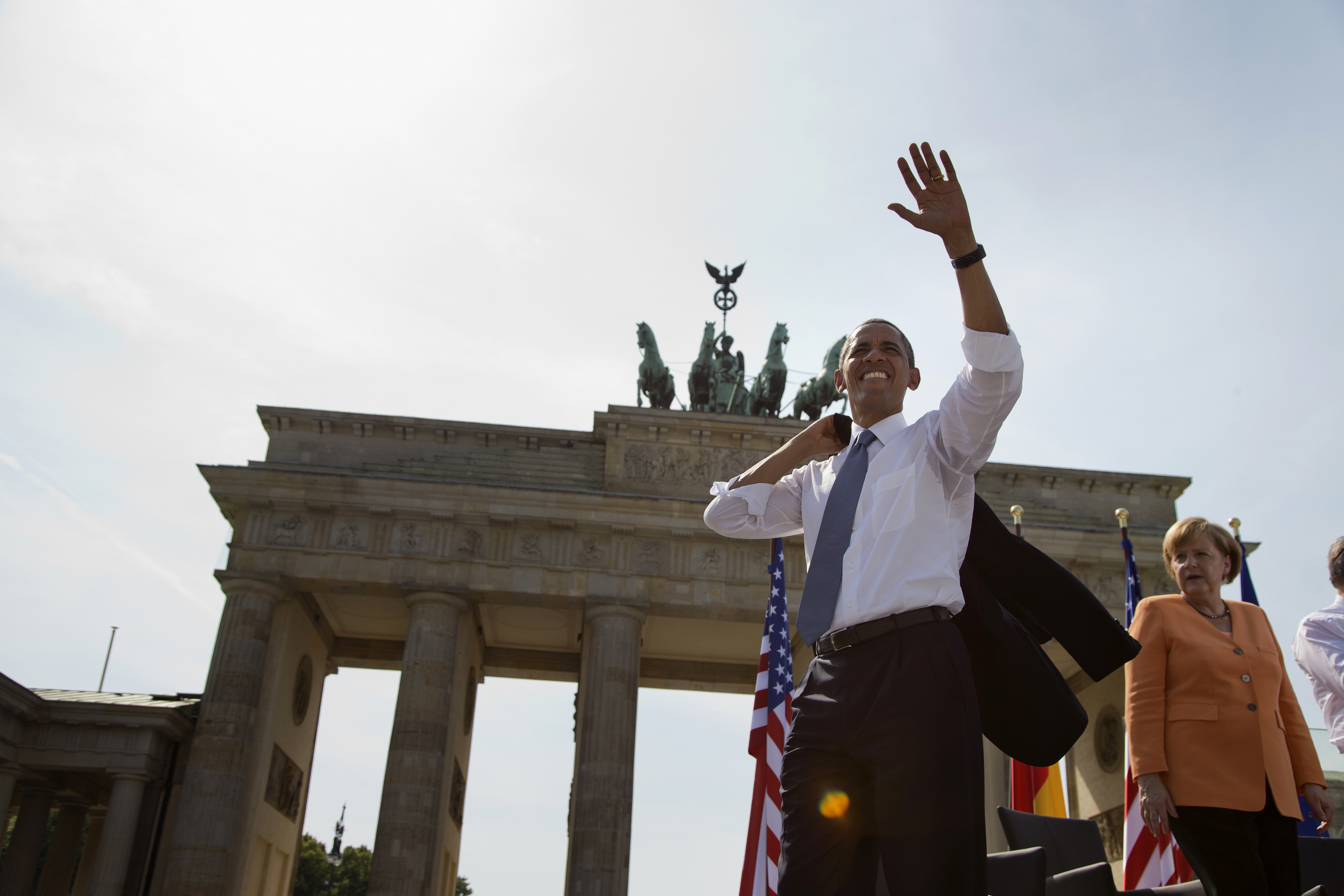 FILE - In this June 19, 2013 file photo President Barack Obama, accompanied by German Chancellor Angela Merkel, waves to the crowd after speaking at the Brandenburg Gate in Berlin. Obama will return to Berlin to attend an event of the Lutheran Church conference end of May 2017.  (AP Photo/Evan Vucci, file) (AP)
