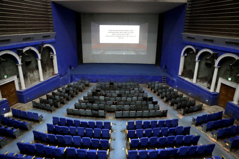 This Thursday, March 30, 2017 photo shows an overview of the colonial era Regal Theater in New Delhi, India. The Indian capital's iconic theater signed off on Thursday night after more than eight decades with nearly 600 movie buffs cheering a 1964 Bollywood classic at a final screening. It's expected to make way for a multiplex from a single screen. () (AP Photo/Manish Swarup)